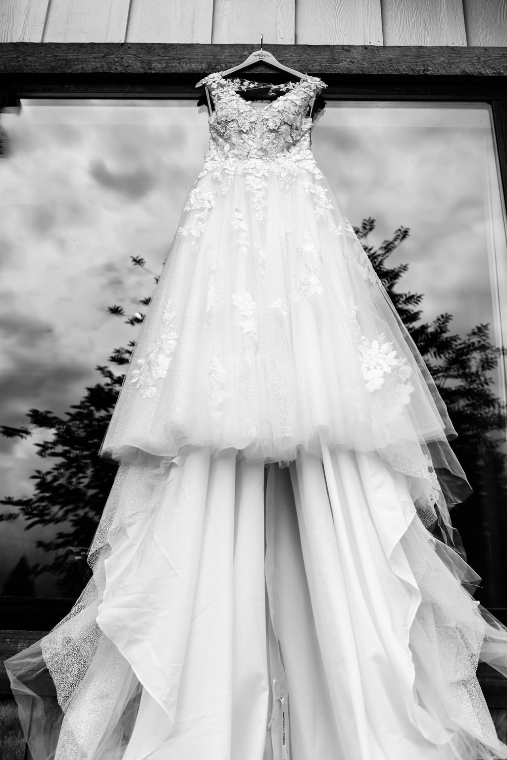 Wedding gown hanging from window at Silver Knot in Montana.jpg