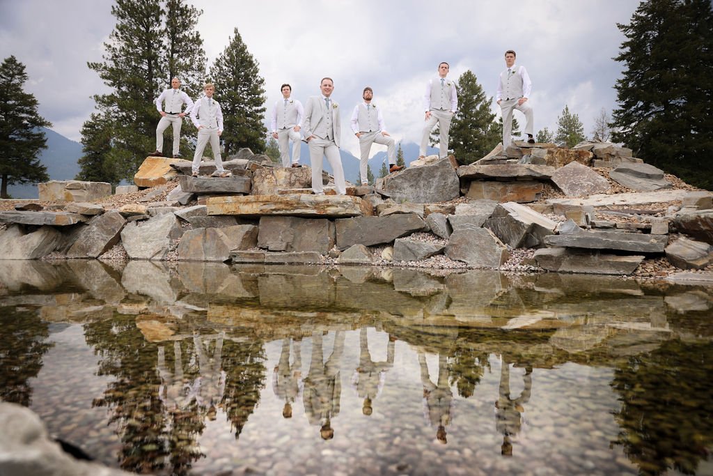 Epic wedding party posing with water reflection at Silver Knot in Montana.jpg