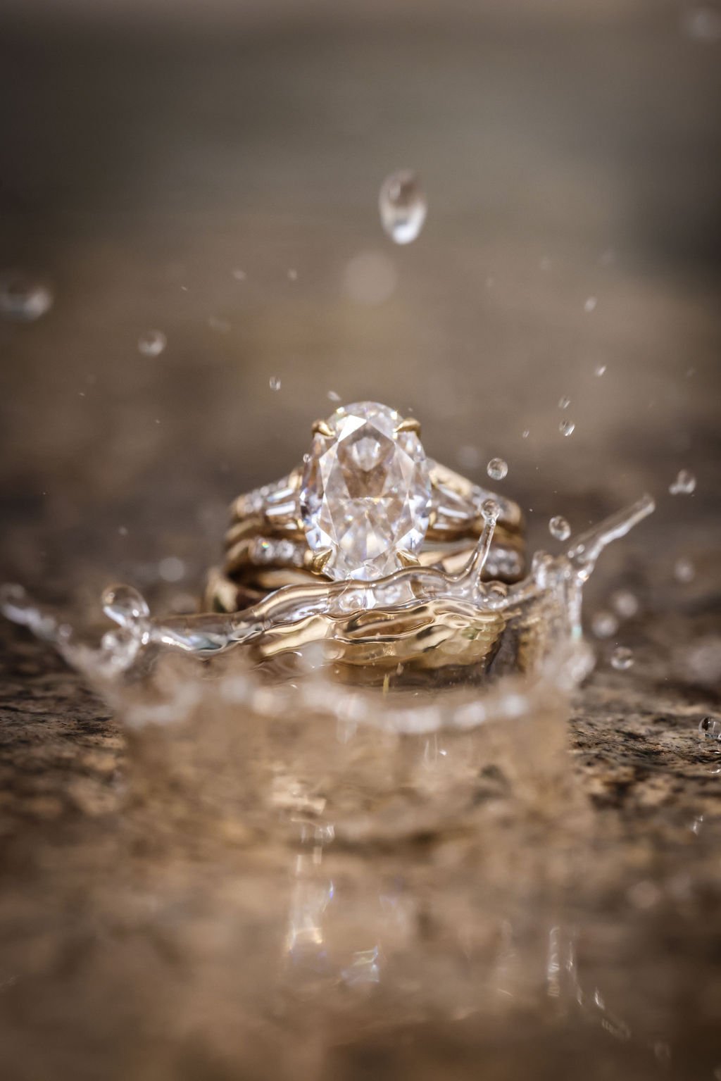 Close up of wedding rings with water splashing around them.jpg