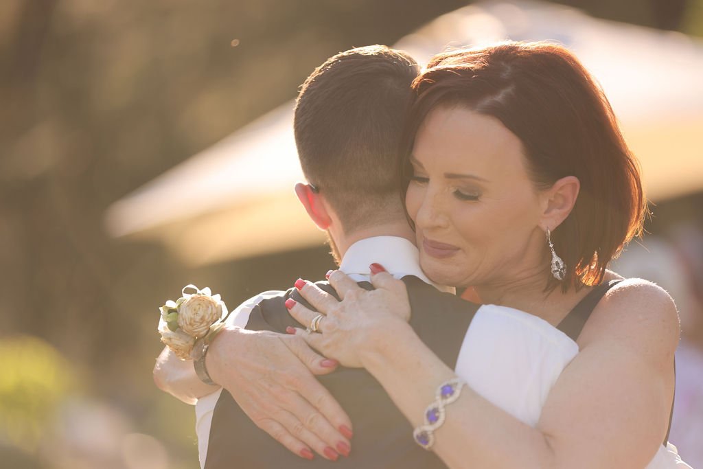 Mother of the groom crying during wedding mother son dance.jpg