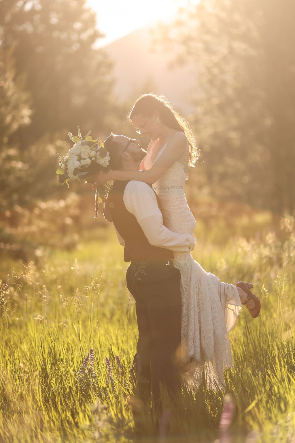 Bride and groom embracing at sunset at the White Raven.jpg