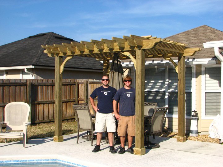 Derek Pratt and Adam Pratt in 2010, next to one of the first pergolas built by the brothers