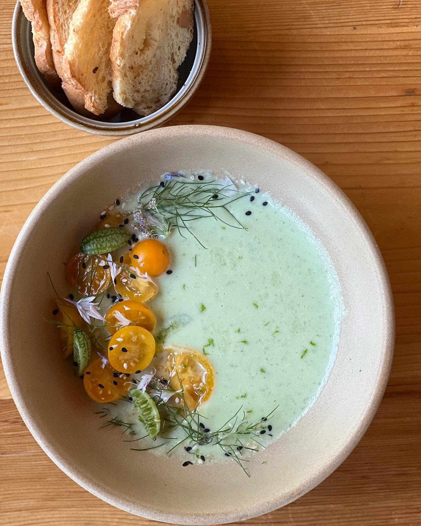 Cool as a cucumber! Cucumber gazpacho made with 2 varieties of cucumbers, thickened with greek yogurt and sesame seeds, brightened with musarat limes, umamied with kombu, topped with marinated tomatoes and cucamelons. All organic produce picked by yo