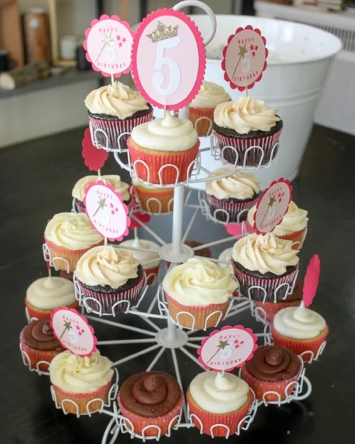 Pretty Pink Princess cupcake toppers complete with the birthday girl's age and a gold glitter wand on cupcakes from The Petite Cakery (she now has a gluten free option!)