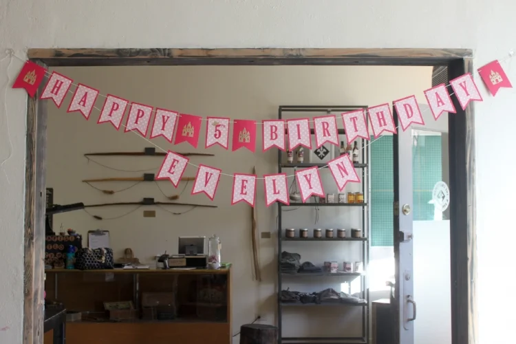 Pretty Pink Princess banner - customized with the birthday girl's name and adorned with gold glitter castles!