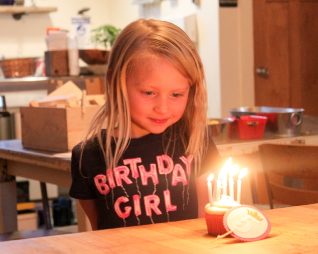The birthday girl illuminated by her 5(!) candles! Next year we'll need bigger cupcakes for these kids and all their candles!