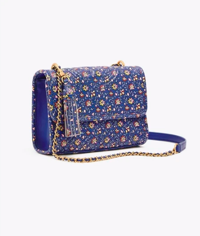 add a pop of color to any outfit with this floral printed handbag !