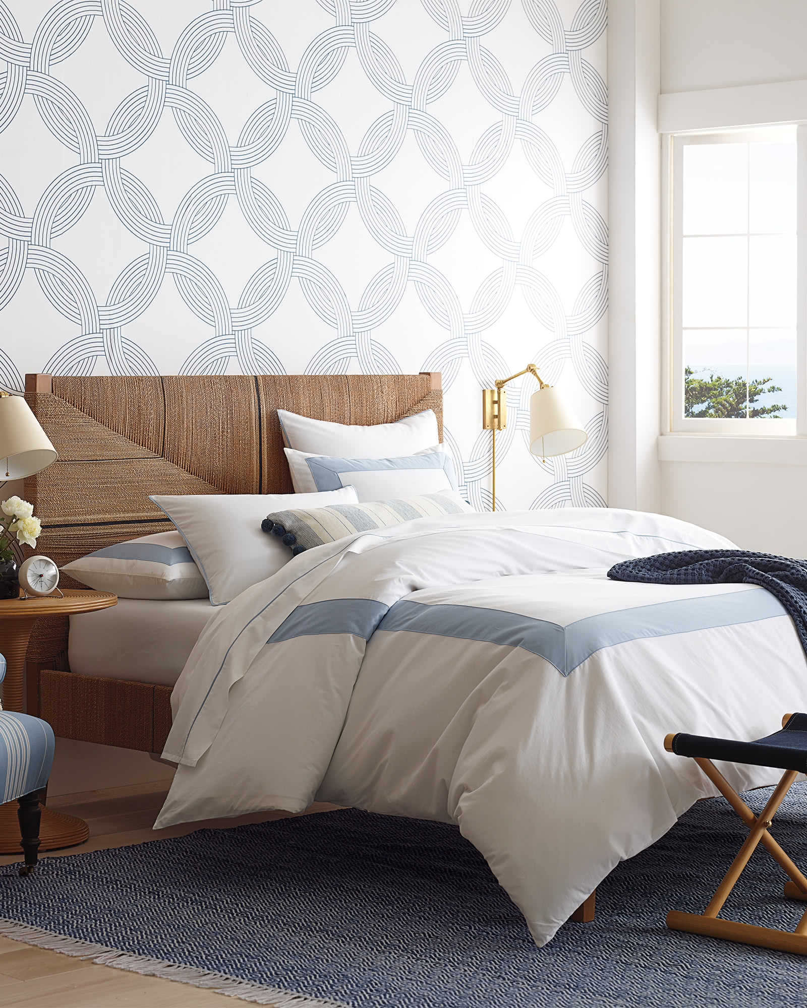 we love the relaxed look of this geometric rug ! it comes in four colors and can be used indoors or outdoors! shop the entire look: bed frame (currently up to 30% off), duvet (currently up to 30% off), and side table !