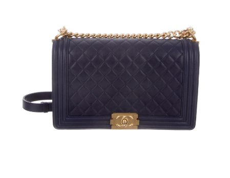 we are absolutely crushing on this navy, quilted bag
