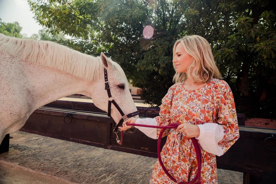 how darling does tory burch look in this dainty floral patterned drop waist dress ?