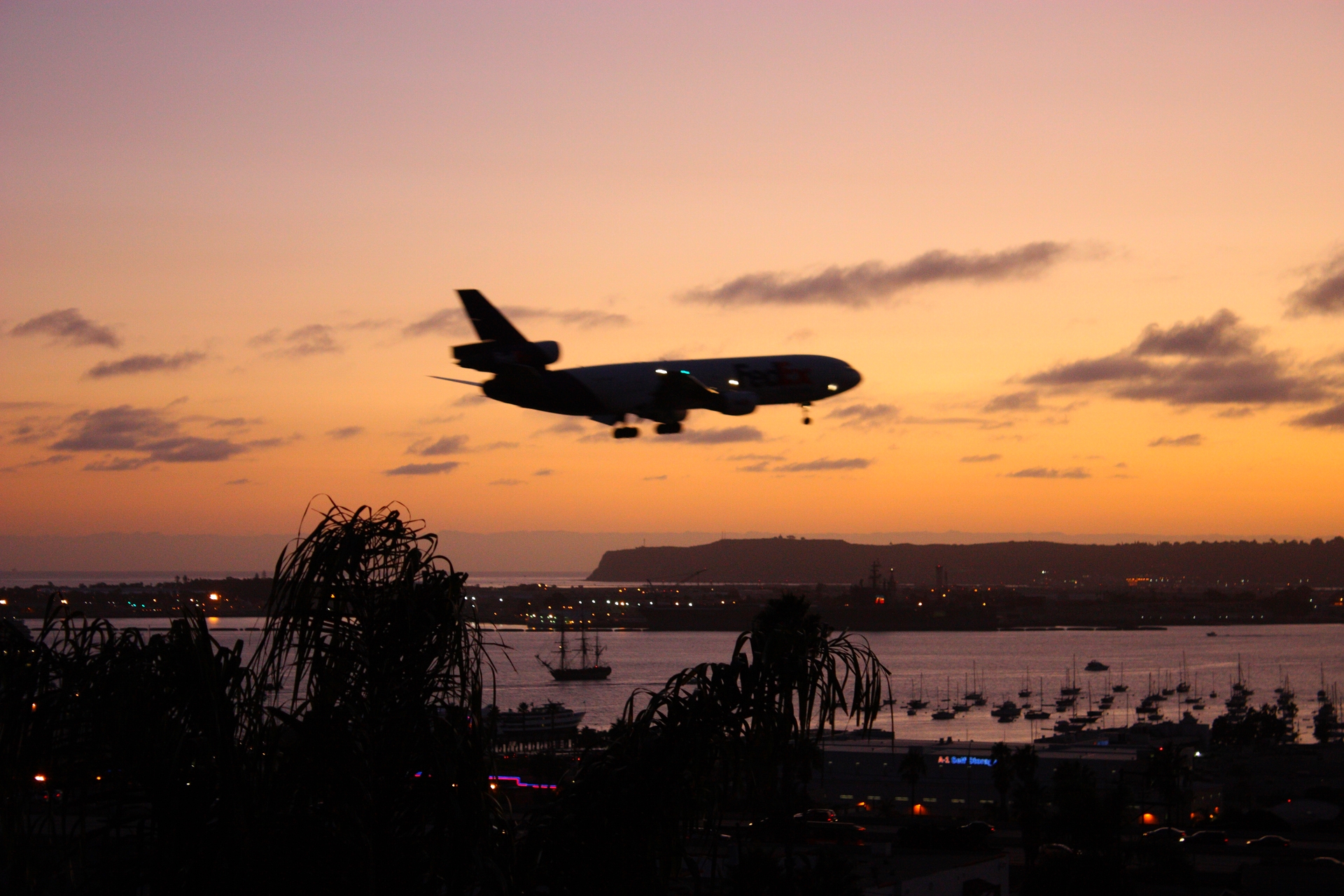 HMS_Surprise_at_sunset_with_airplane.jpg