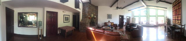 The Retreat Center Great Room serves as the entrance to Retreat guests. A stone fireplace and large picture windows face the front porch and lake. A small commercial kitchen is available to prepare light fare.