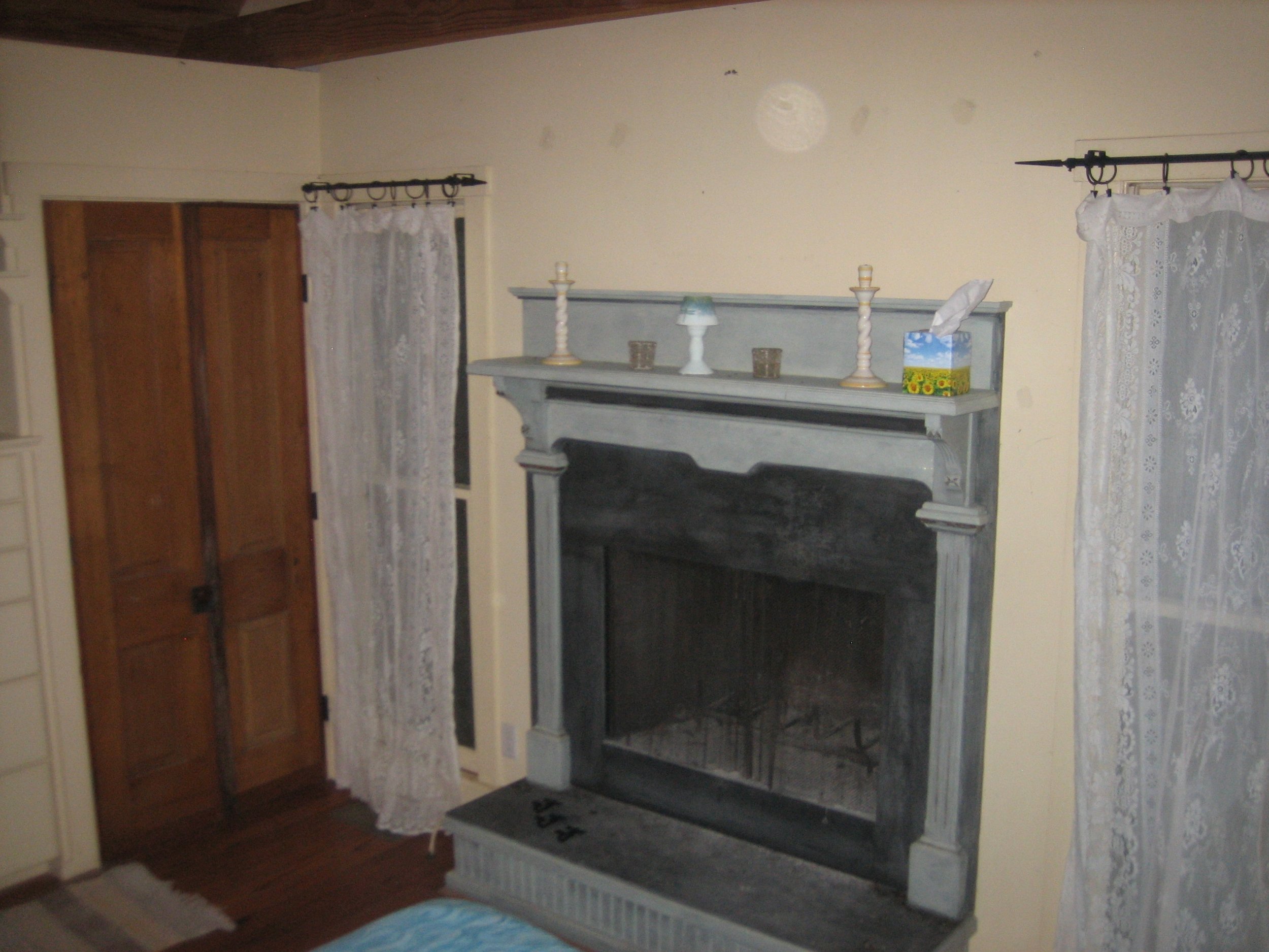 PondHouse BR1. DragonflyBedroomFireplace.JPG