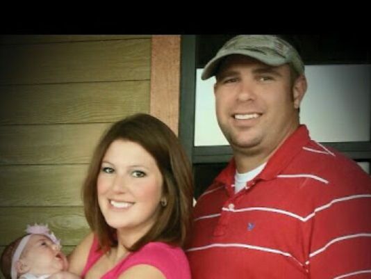 Lieutenant Jordan Howard with his wife and daughter