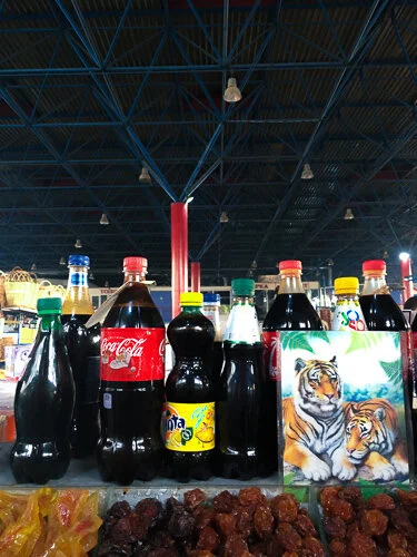 A booth selling mulberry molasses in used soda bottles at GUM, the central market in Armenia. (GUM is an acronym that means “state universal store” in Russian.)