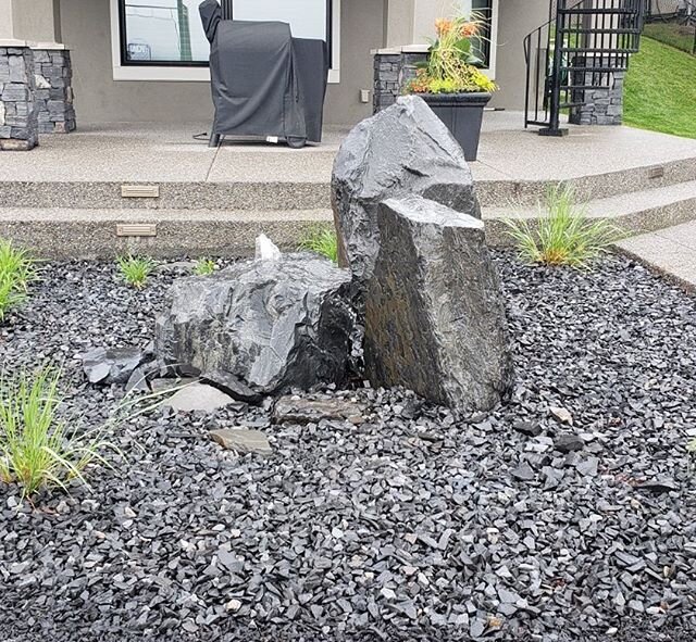 Love the mountains? Bring a piece of them home to your own urban backyard with a water feature like this one we designed for a home in Cranston, consisting of beautiful Rundle Rock from Thunderstone Quarries.

Scope Projects 
Landscape Architectural 