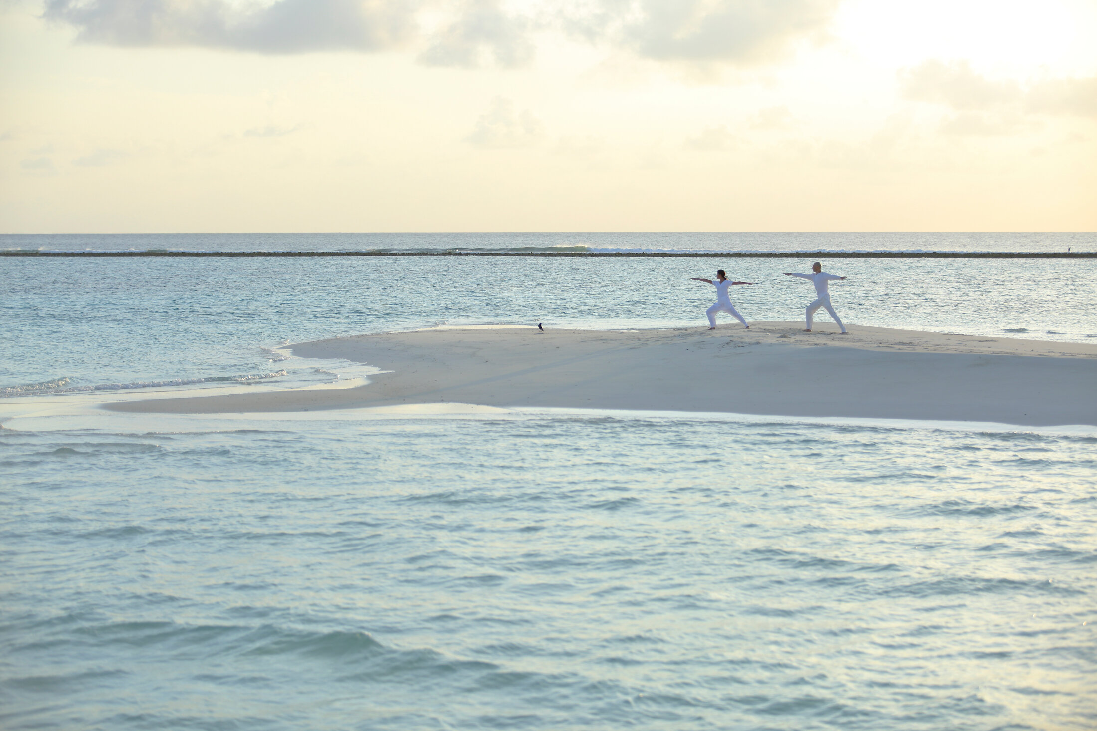 3933_Soneva Jani - Yoga on the Beach.jpg