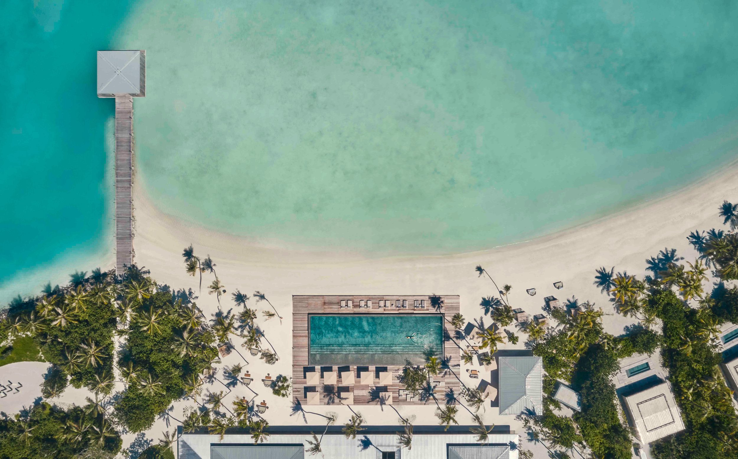 PATINA_MALDIVES_MAIN-POOL_VELI_BAR_POOL_AERIAL.jpg