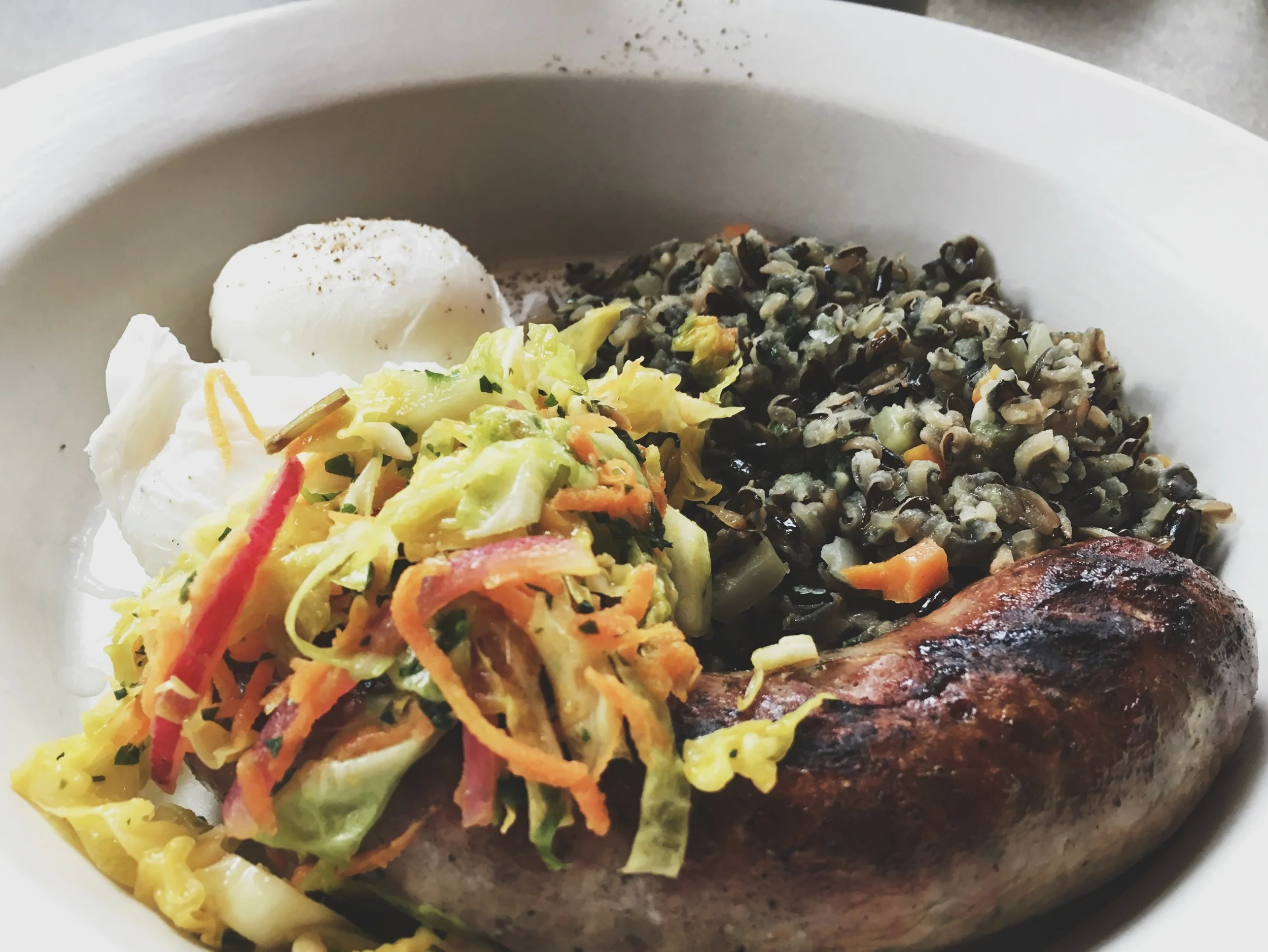 Thai Sausage with something something curry cabbage, something something wild rice and a poached egg from Nopa SF.