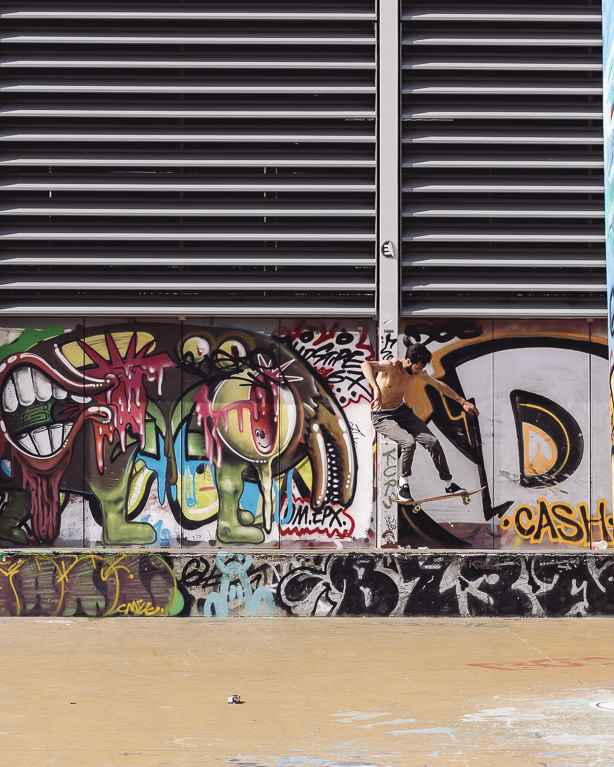 Skateboarder and grafitti