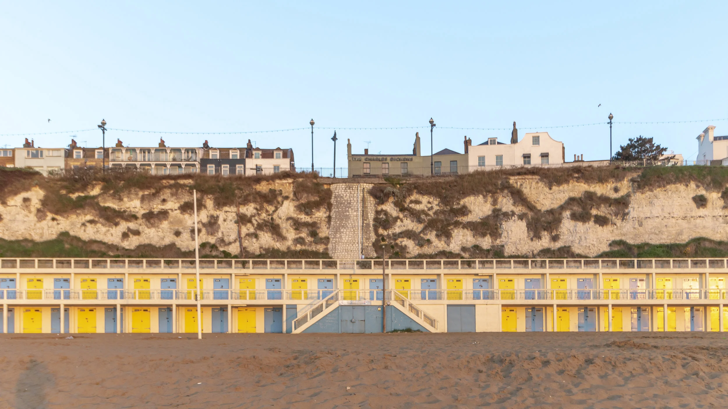 Sunshine yellow and sea blue beach huts at the back of Viking Bay. So summery.
