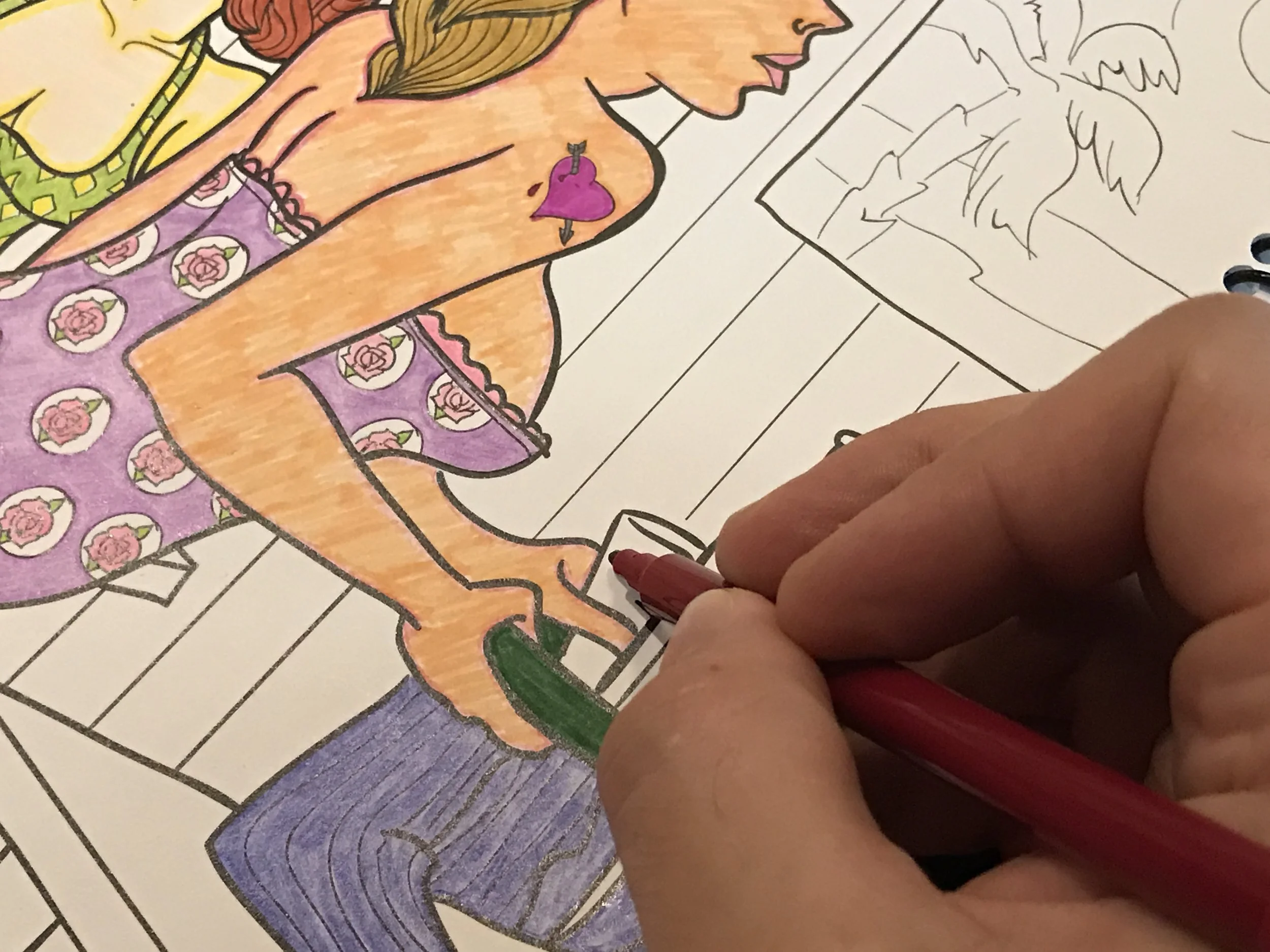 Zach coloring an illustration from Ladies in Action.