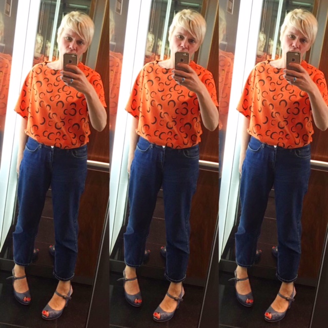 Trudi in her Orange Eclipse Neat Top