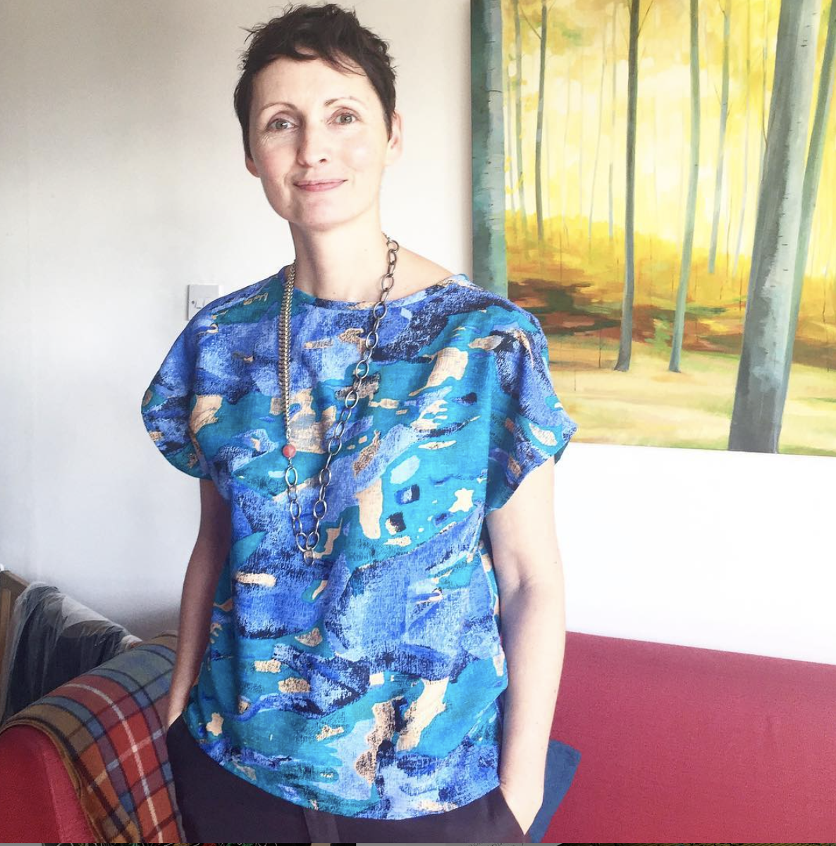 Brigitte of @twistedvintagejewellery in her Painterly View Neat Top with cap sleeves