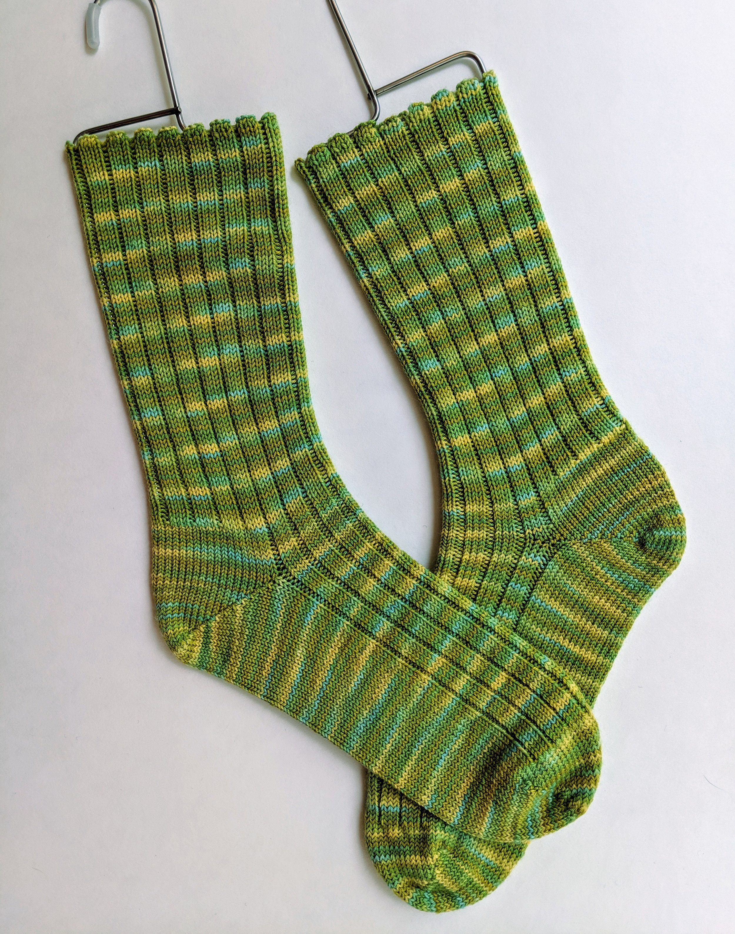 Shades of green ribbed socks; wool and nylon