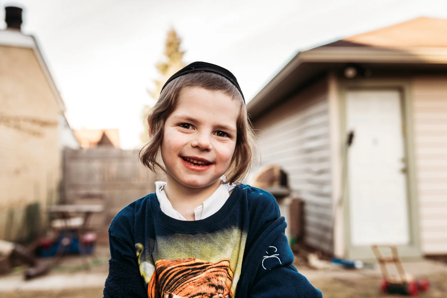 And I love this precious face of my son, but between the house, the garage, the fence and that toy lawn mower... But I still love this photo! It's so him!