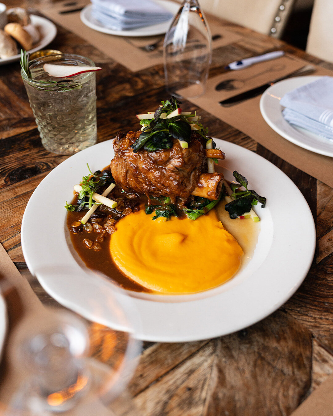 Warming spices and flavors to welcome Fall! 

APPLE CIDER BRAISED PORK | This 6-hour braised heritage pork shank is served with Sweet Potato Puree, Golden Raisins, and a Fresh Apple and Watercress Salad. 

Compliment your entree with our PERFECTLY PE