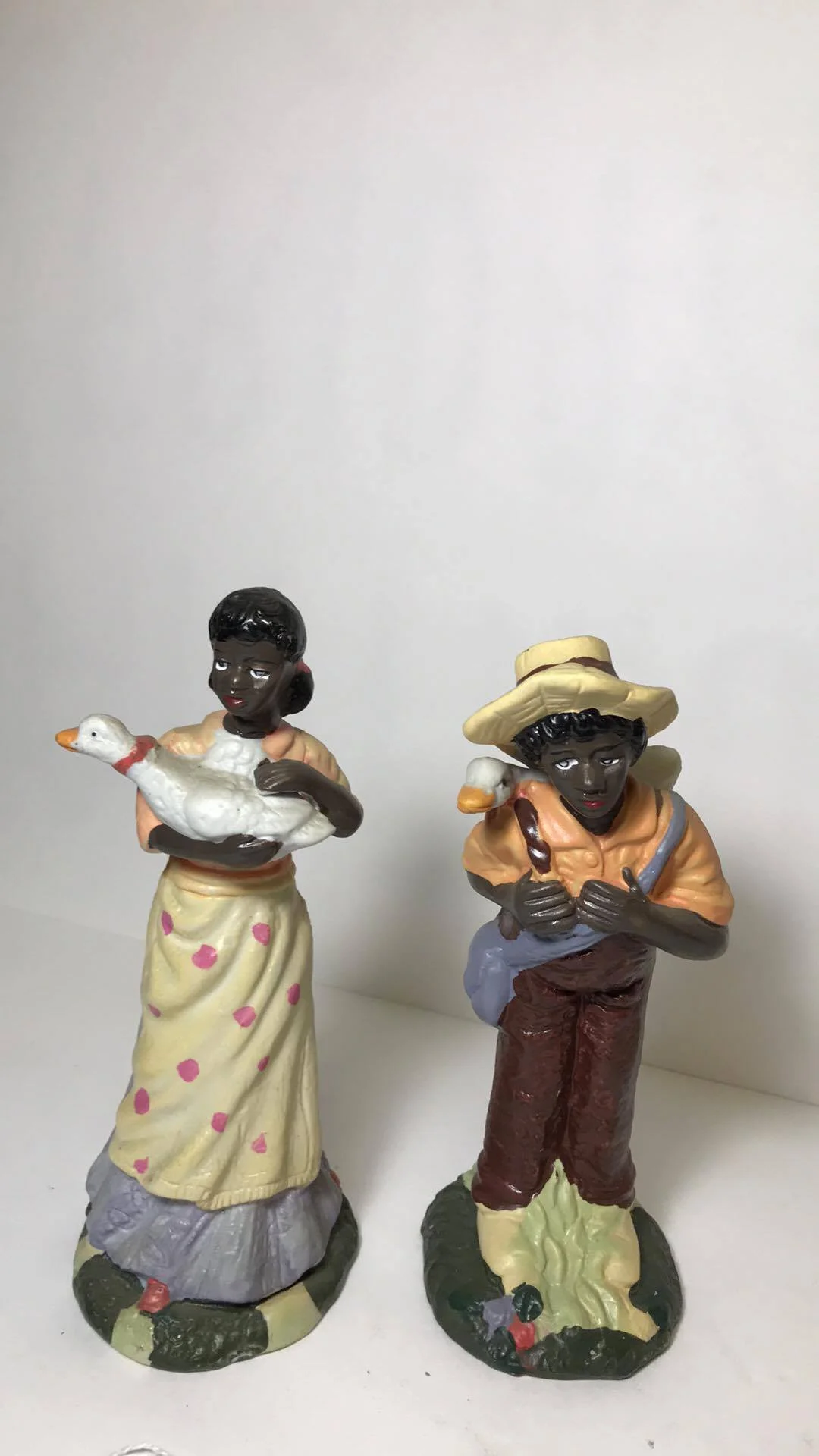 Man and Woman set carrying 2 ducks.jpg