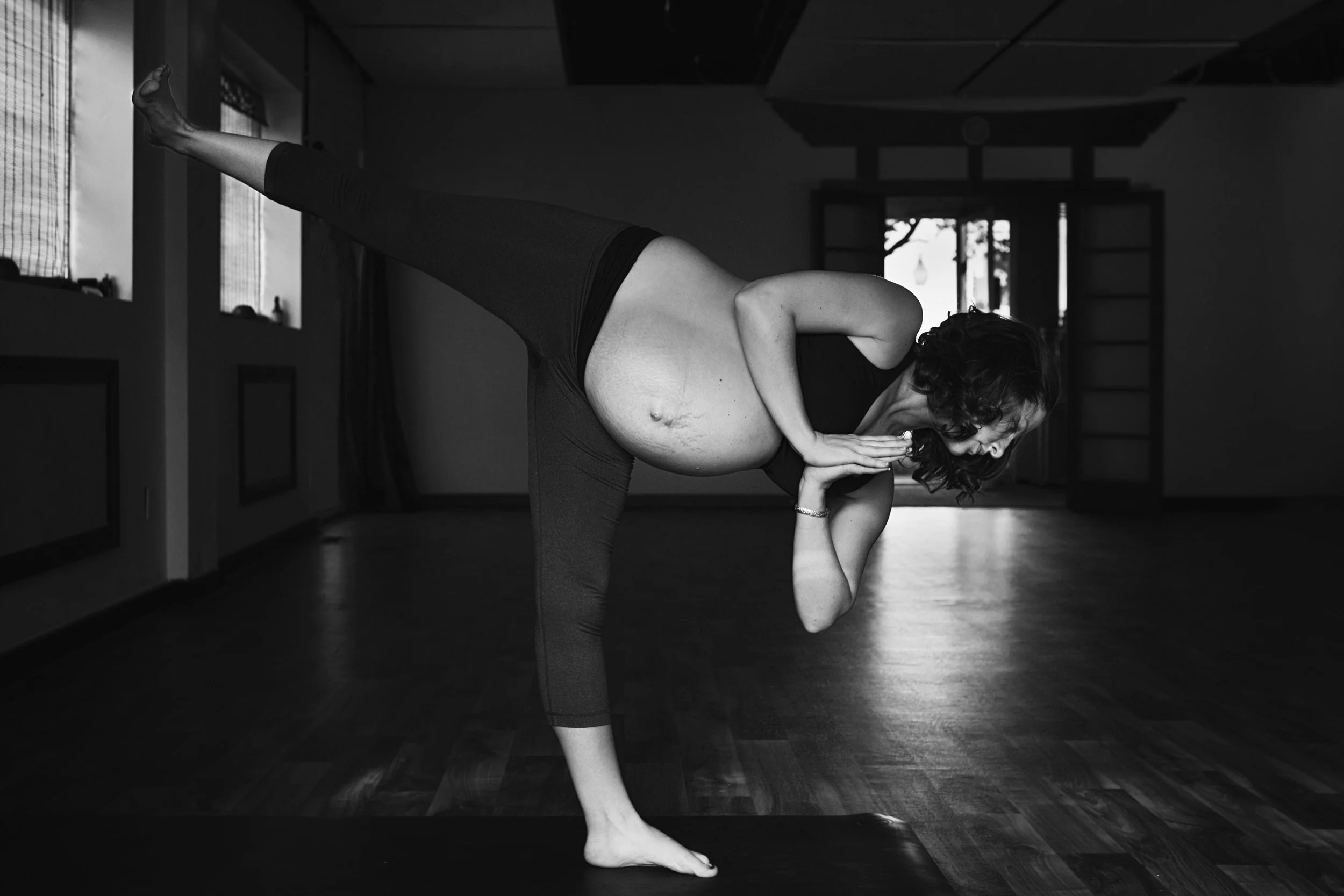 Black and white RVA birth photographer photographs pregnancy at The Yoga Dojo