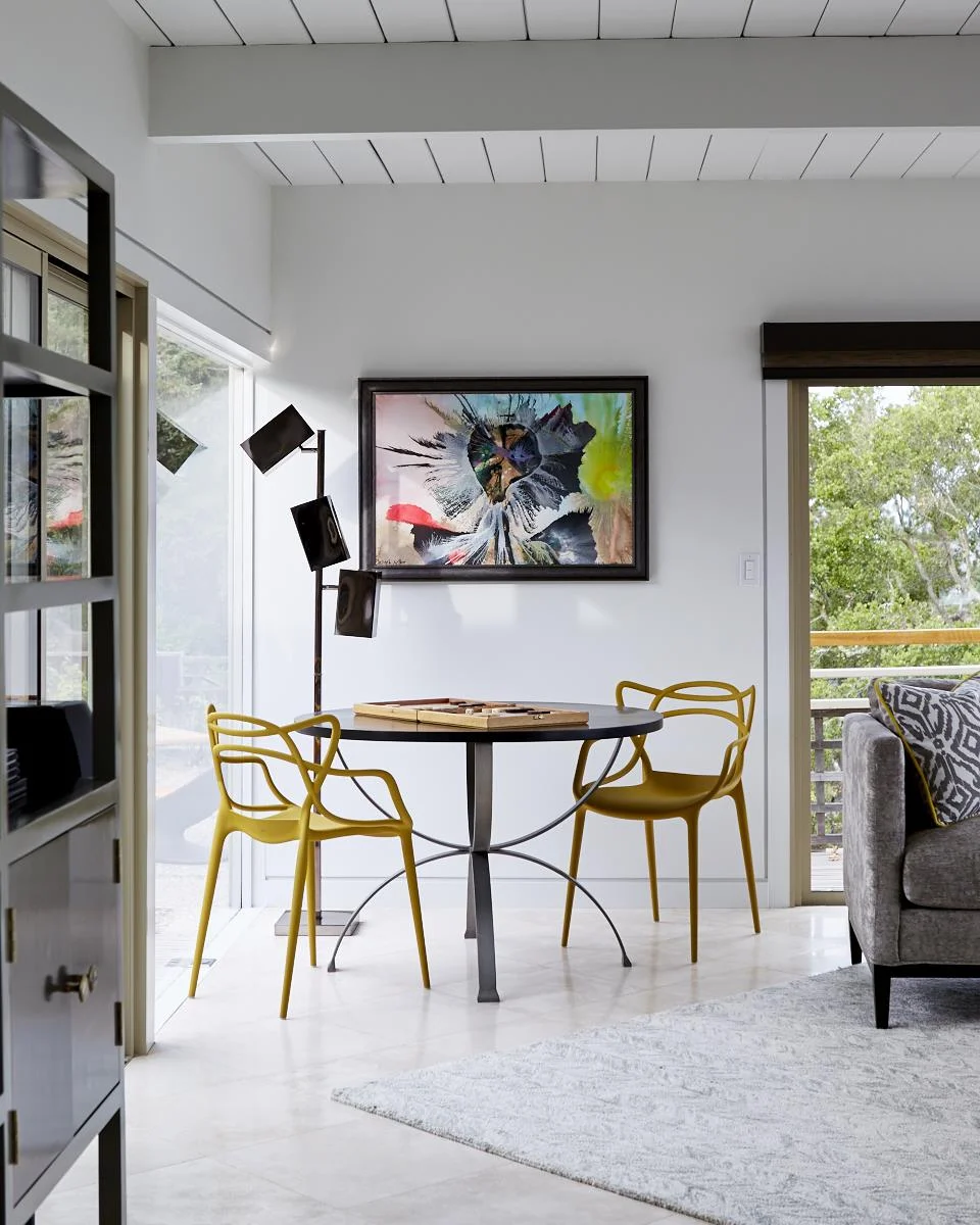 Client's artwork, lamp by Arteriors, rug by West Elm, table by Redford House, chairs from All Modern