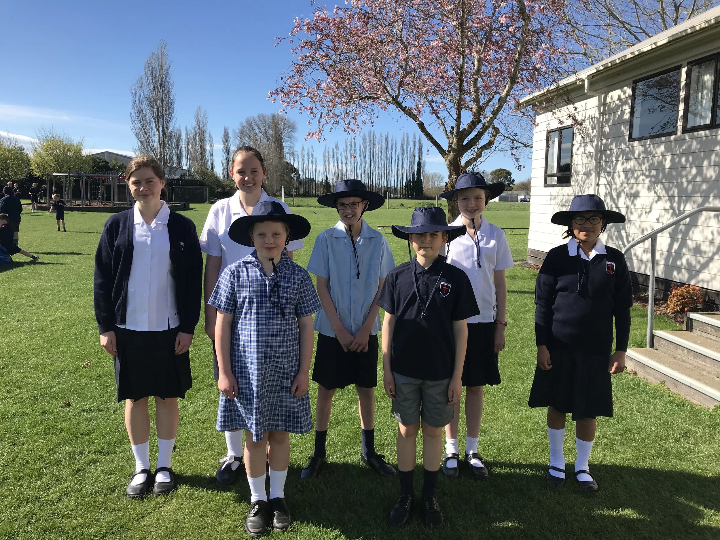 Summer Uniform Year 1-6 (Front) and Year 7-10 (Rear)