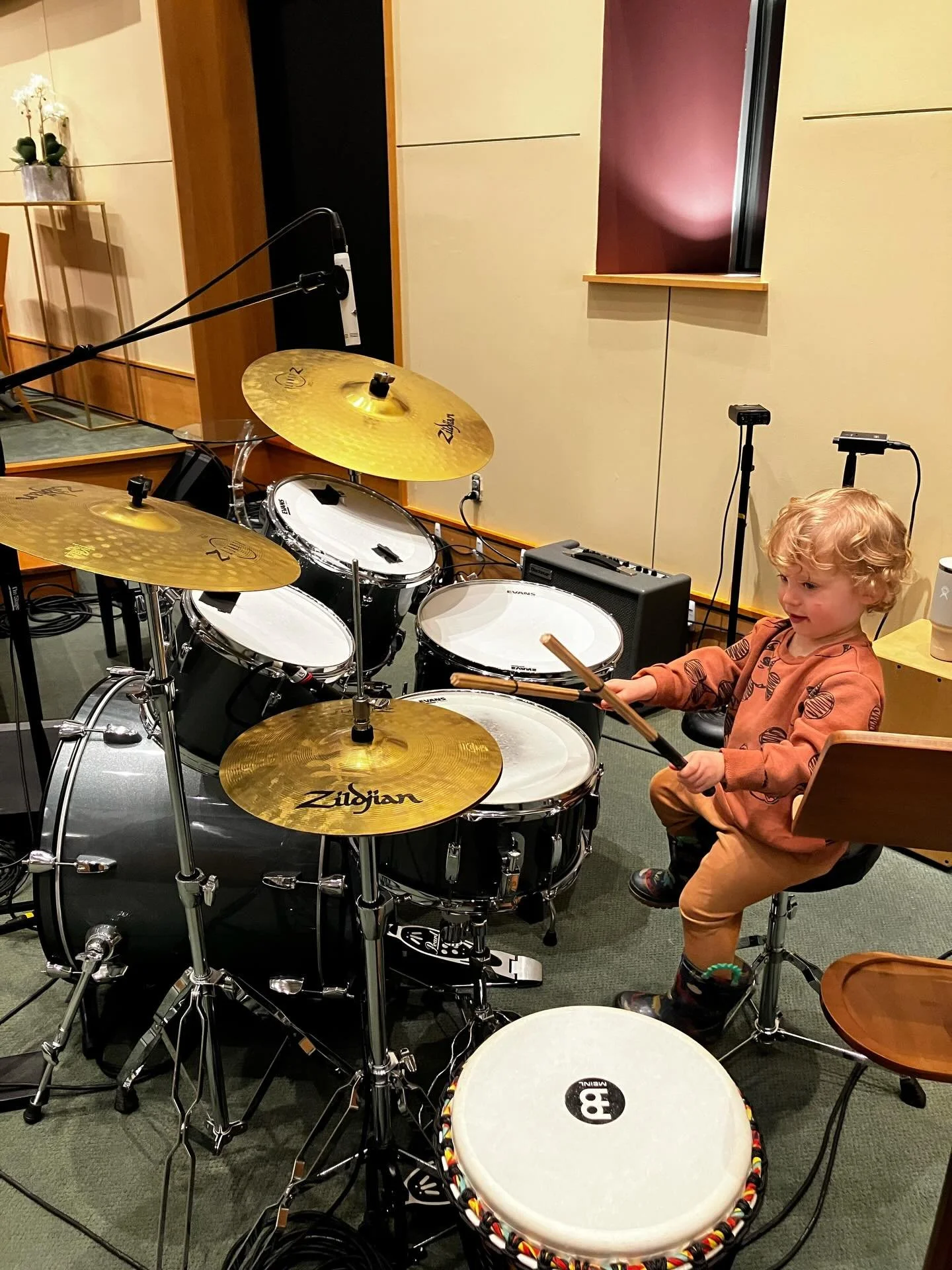 Nothing cuter than blonde curls checking out a drum set on Shabbat!