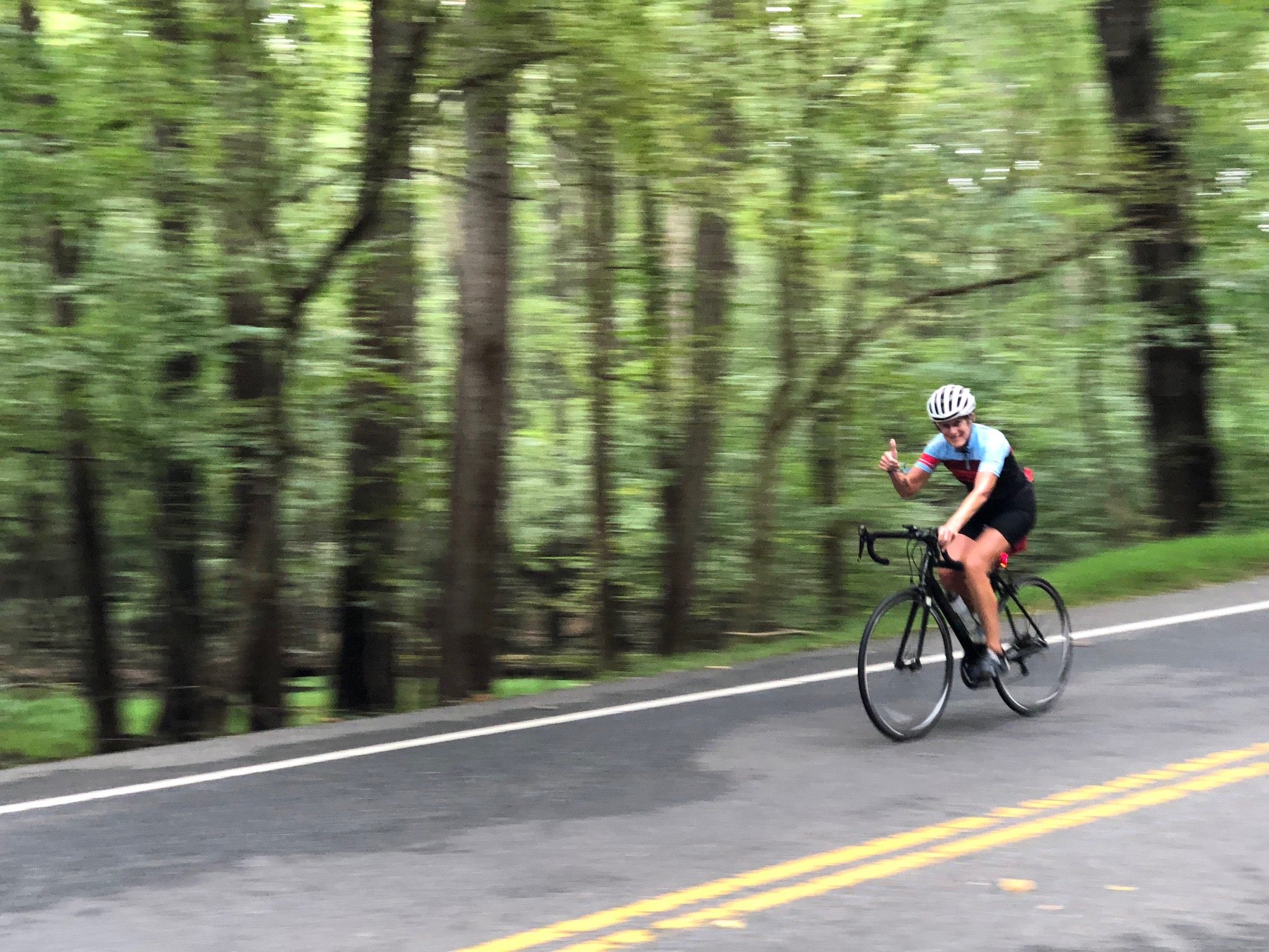 Clare biking down hill.jpg