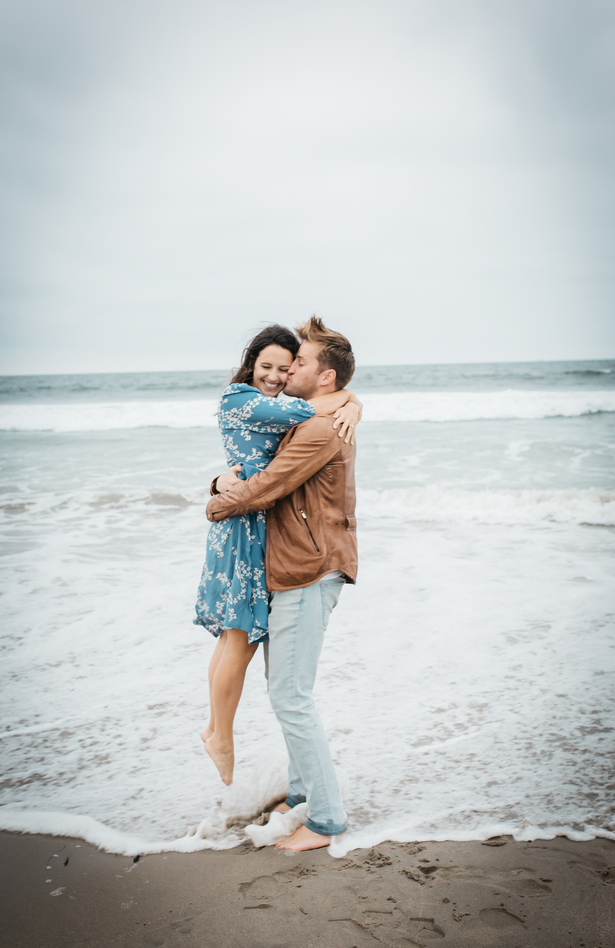 Couple Hugging at Beach Photo By Jenn Morse Weddings