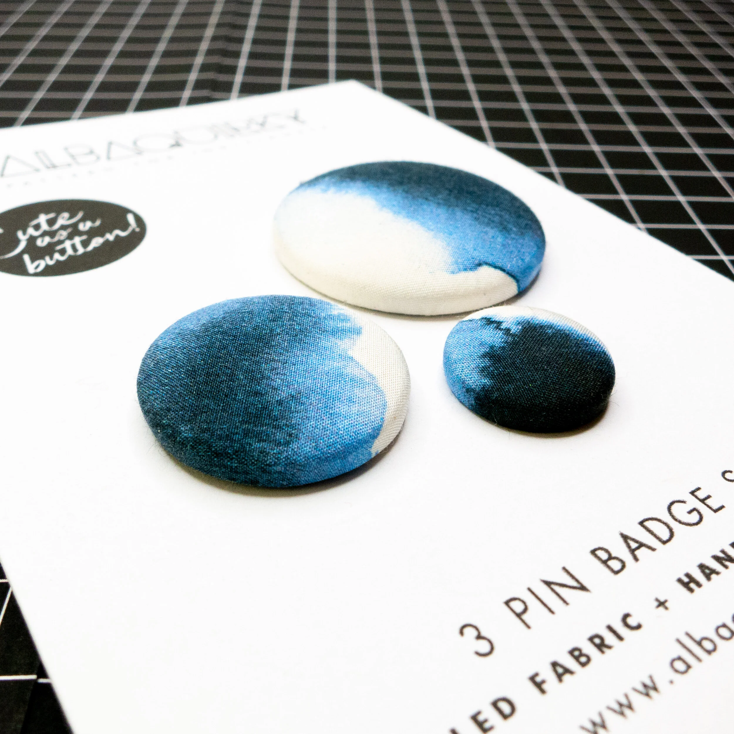 03_albaquirky_pin_badge_blurred_shadows.jpg