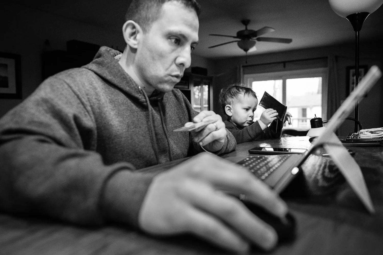 Northern Virginia family lifestyle and documentary photography, f ather and son internet purchase activity