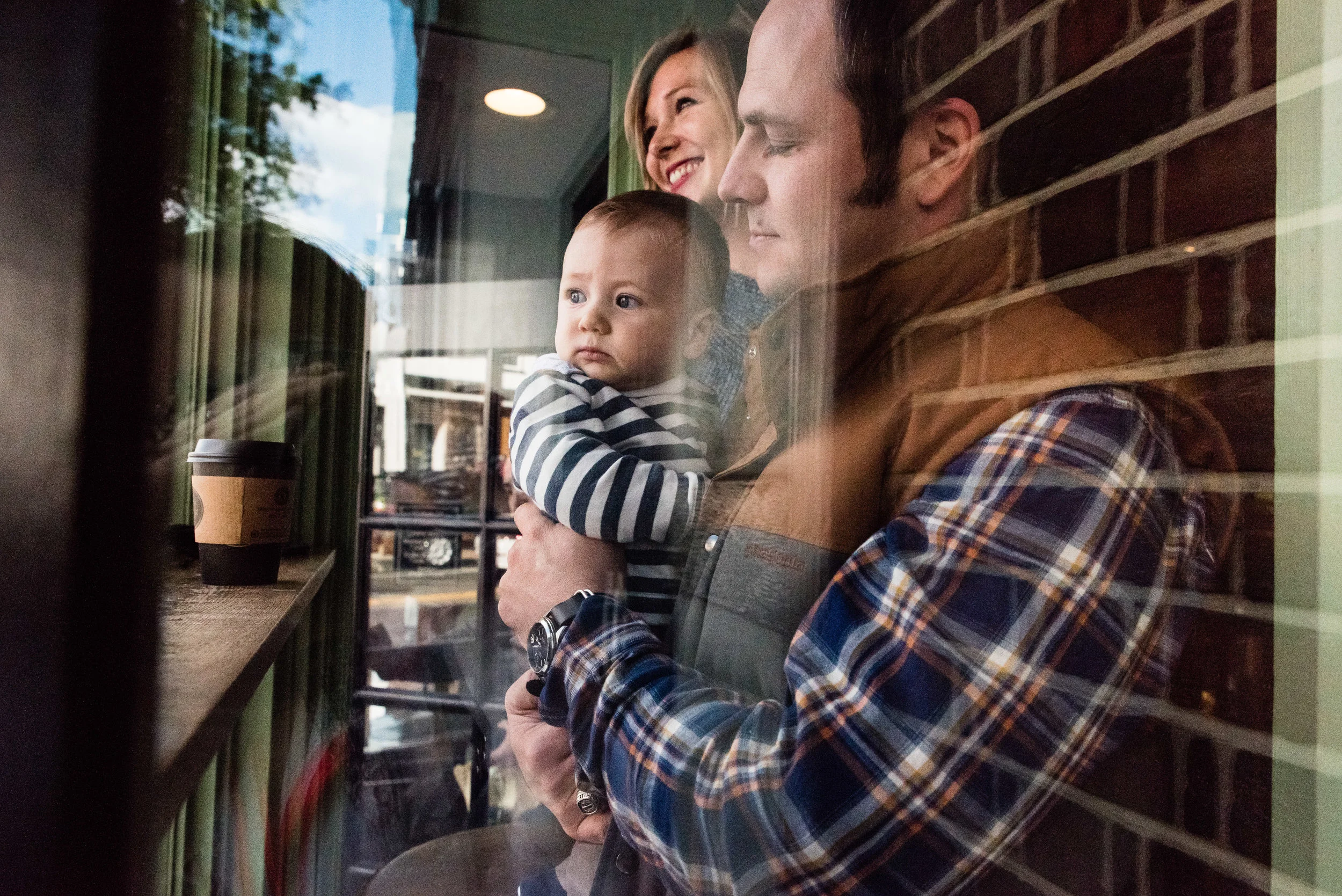 Family in window of coffee shop in Georgetown, D.C. | Washington, D.C. Family Photographer
