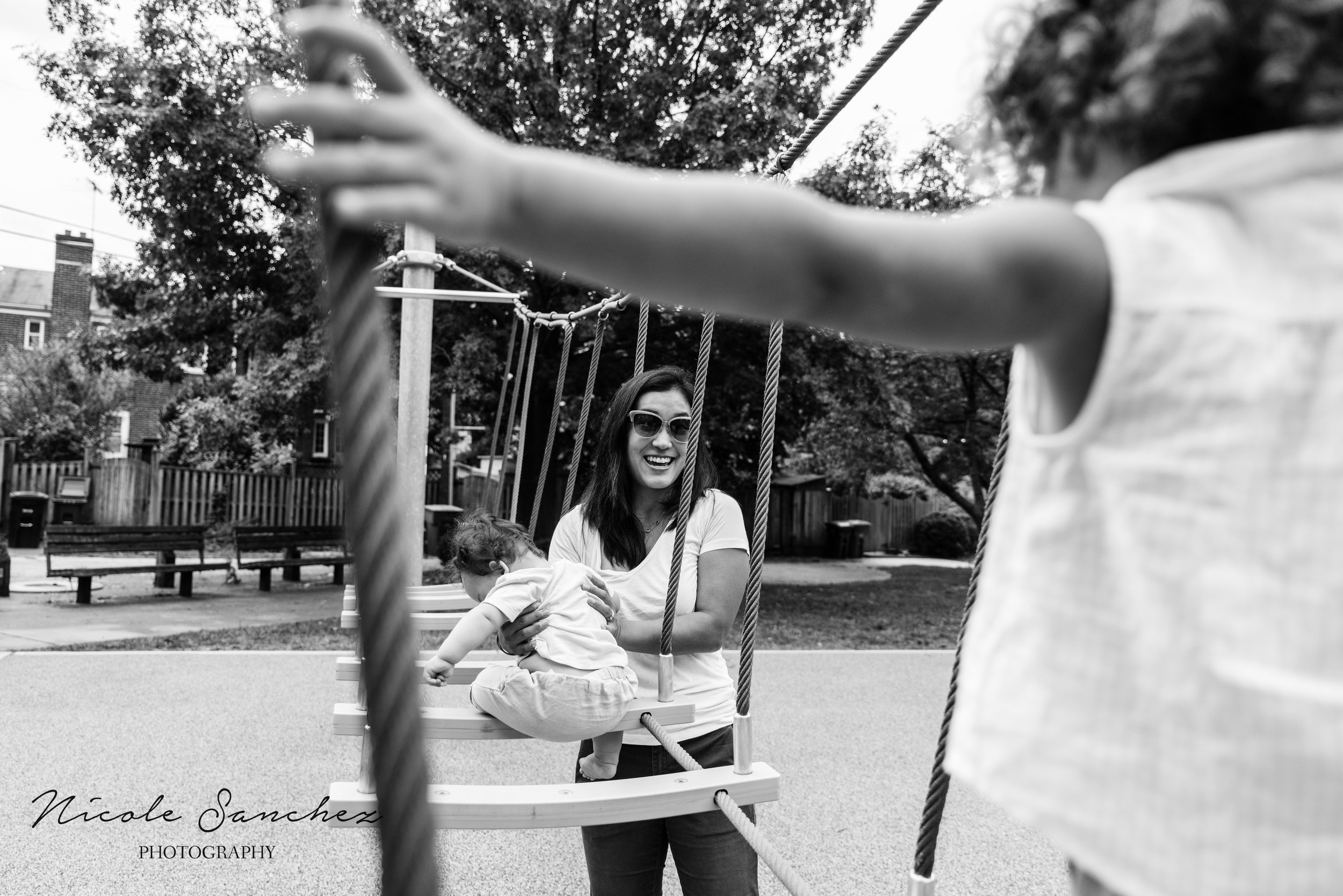 Girl crossing bridge to mom | Old Town Alexandria, VA Family Photographer