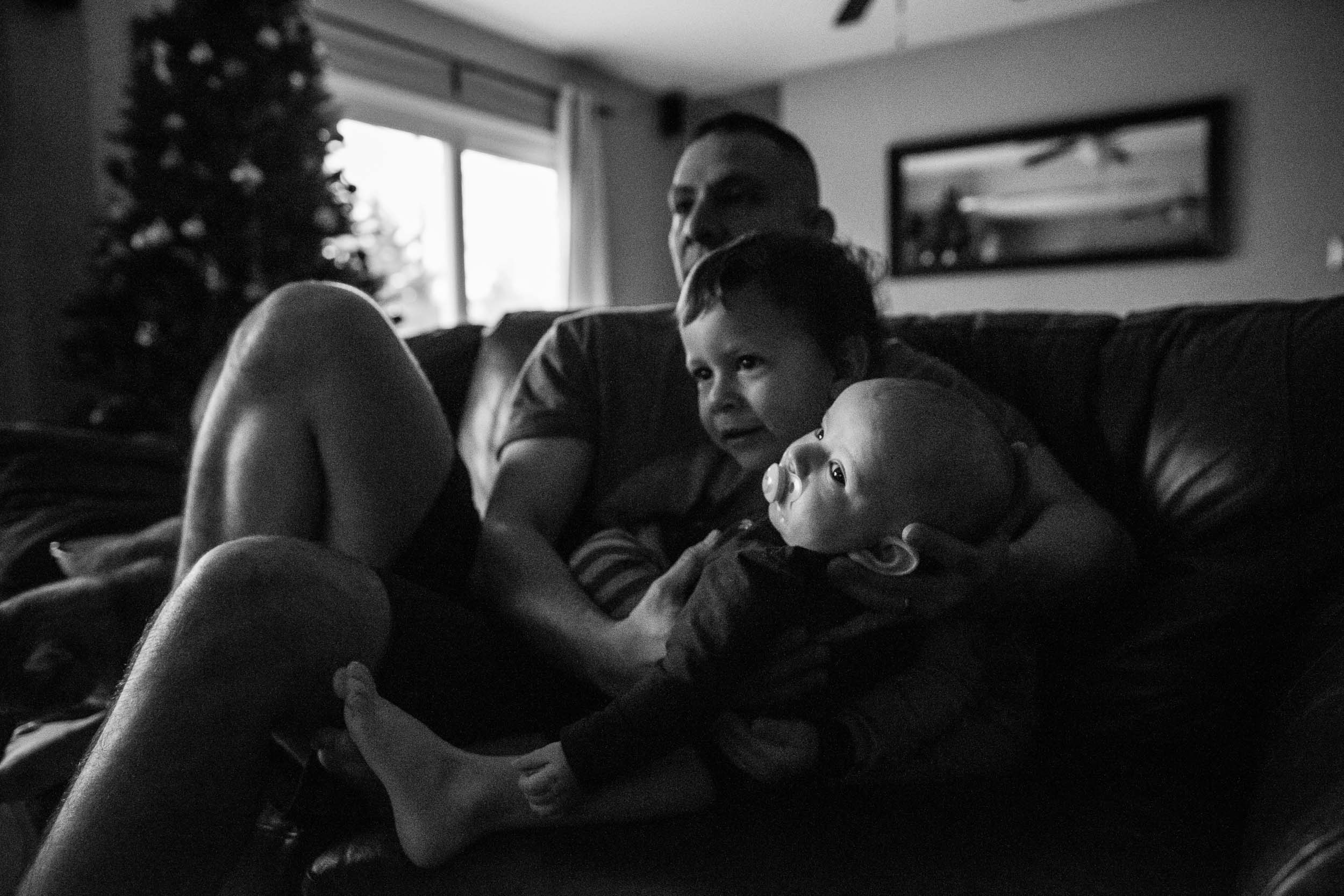 two boys and father in Alexandria, VA by family photographer Nicole Sanchez