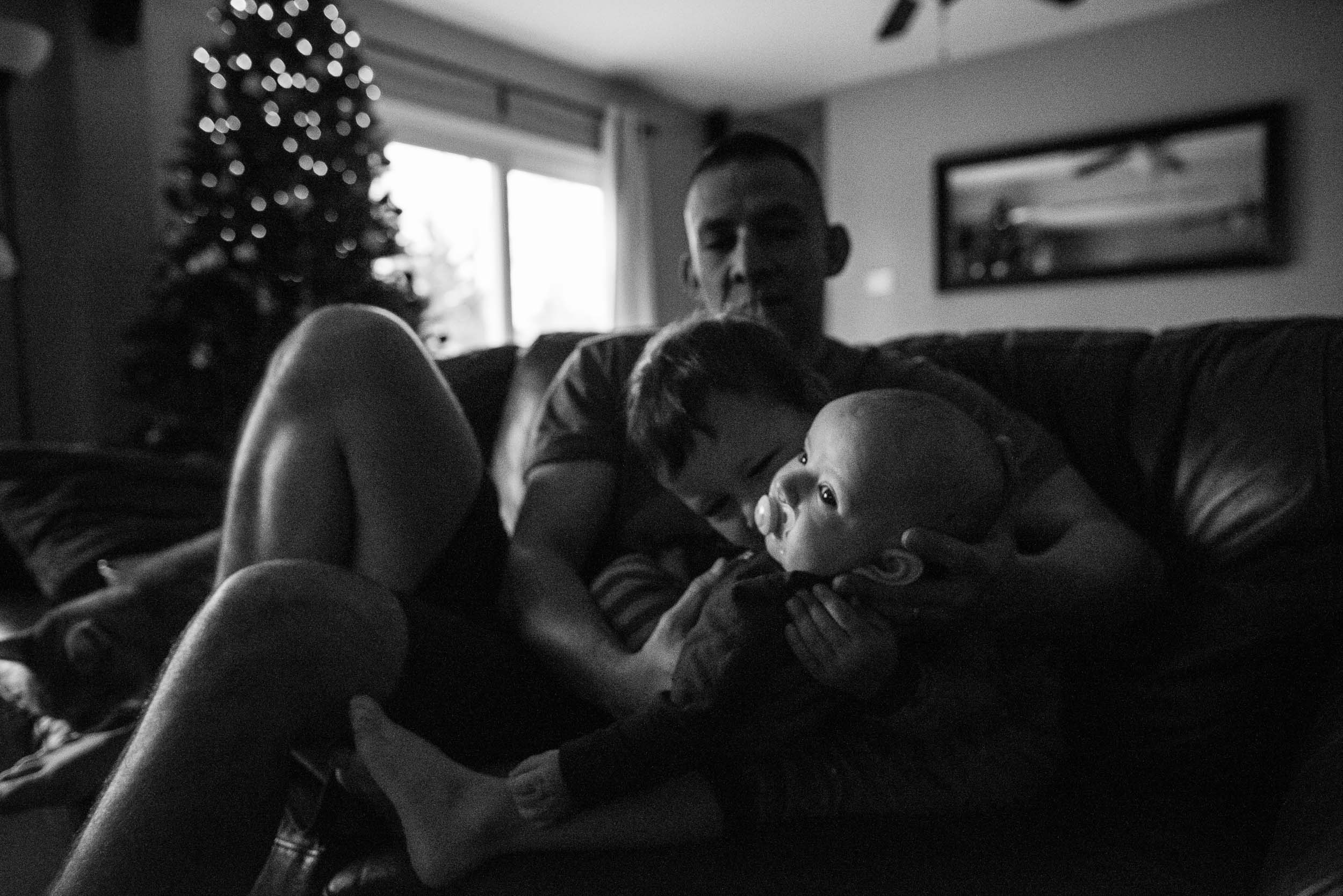dad holding sons in Northern Virginia by family photographer Nicole Sanchez