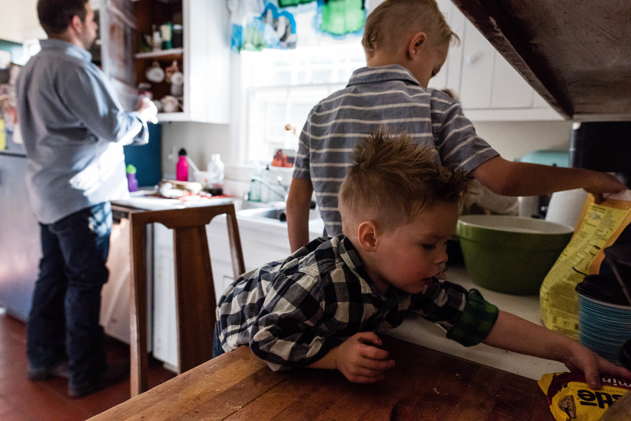 Boy sneaking chocolate by Northern Virginia Family Photographer