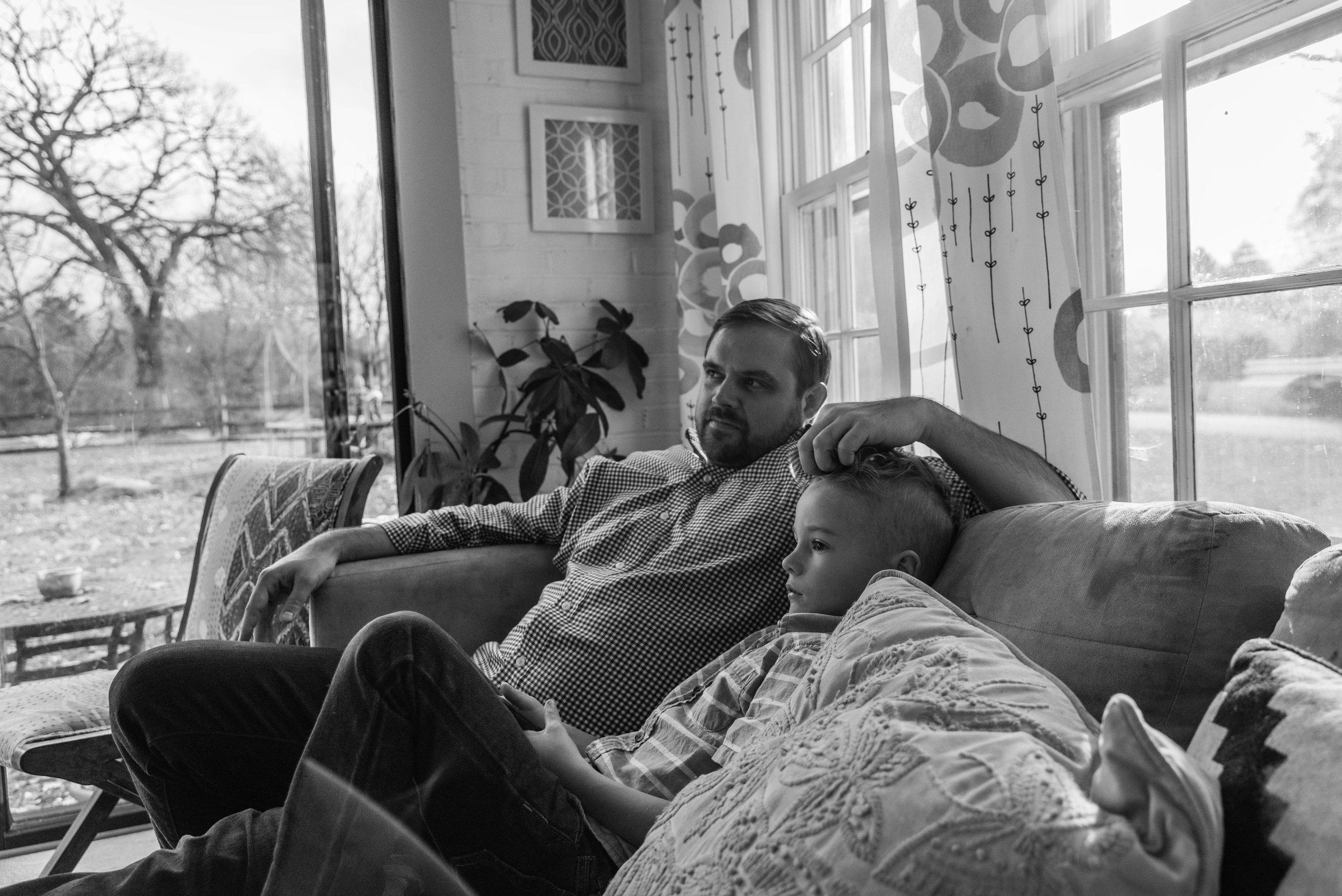 Father and Son watching soccer on TV by NOVA Family Photographer Nicole Sanchez