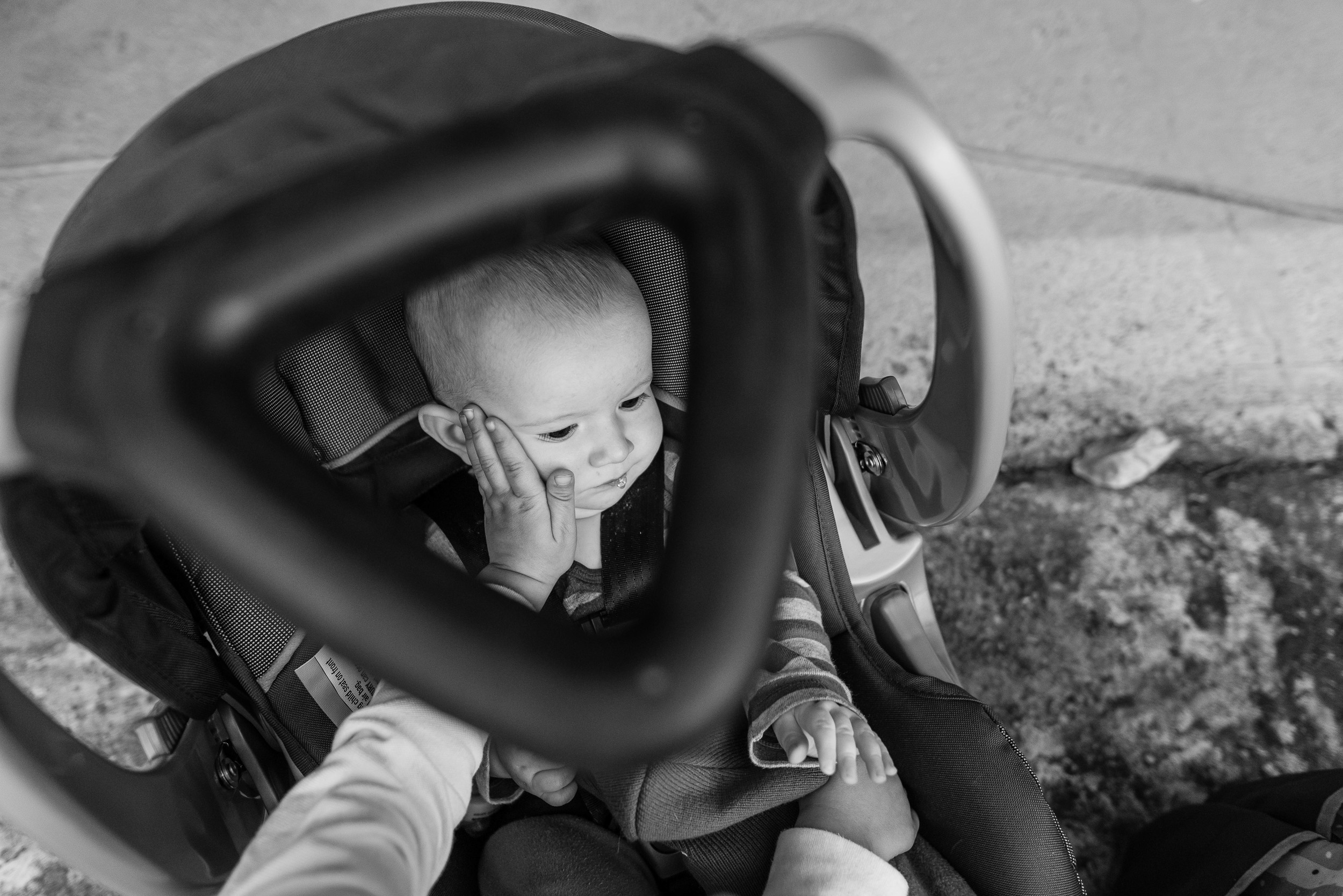 Baby-through-car-seat-handle-from-above-by-Northern-Virginia-Family-Photographer-Nicole-Sanchez