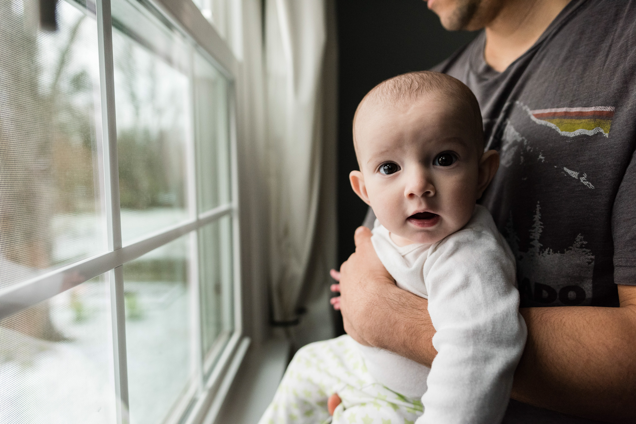 Baby-with-dad-at the window-by-Northern-Virginia-Family-Photographer-Nicole-Sanchez