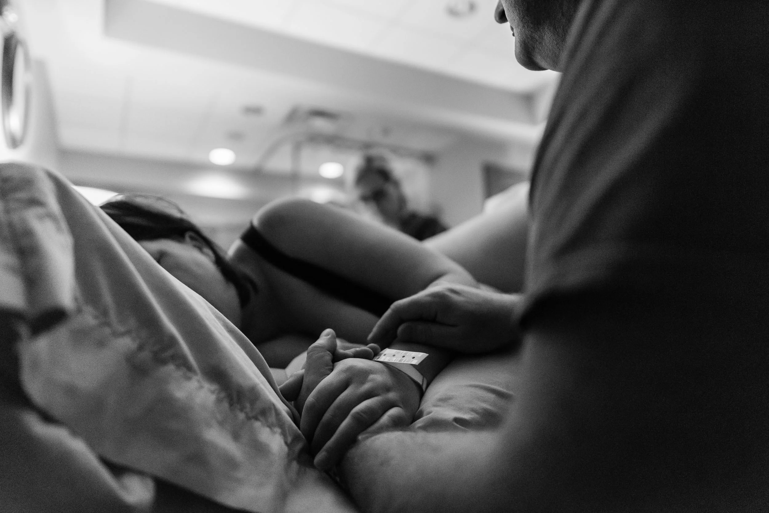 Woman in labor at Inova Loudoun in Northern Virginia by Family Photographer Nicole Sanchez