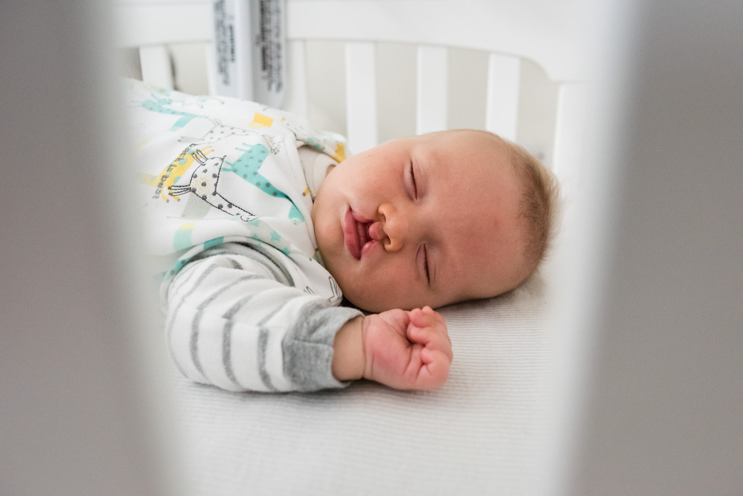 Baby boy sleeping in crib in Washington, DC by Family Photographer Nicole Sanchez